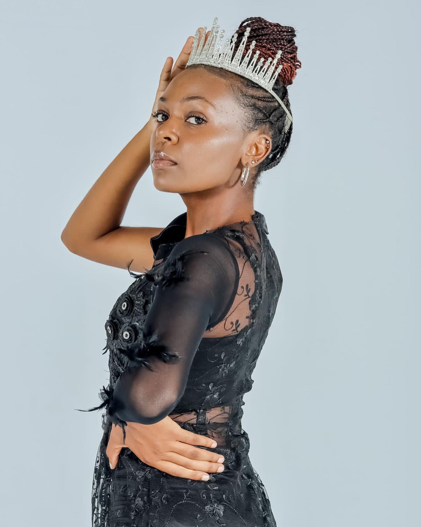 Crowned contestant in black lace